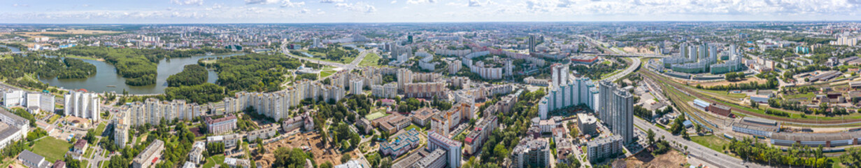 Fototapeta na wymiar Aerial panoramic view, cityscape of Minsk. City landscape with the river Svisloch and Victory Park