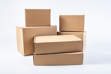 Bunch of blank courier box paper boxes on white background