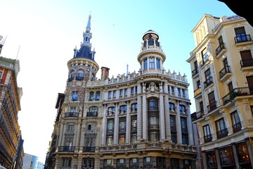 Fototapeta na wymiar Ornate Facade of typical residence/ commercial Buildings and streets in City of Madrid, Spain