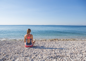 Fototapeta na wymiar woman enjoy tropical vacation. Resting relaxing on the beach near sea. Greece