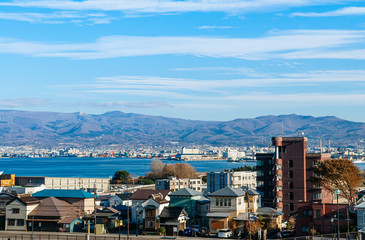 Hakodate harbour bay and cityscape with mountain view and blue sky