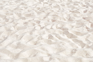 Beach sand natural color background. Top down aerial view of white sand dunes. Sandy surface pattern. Texture of soft material. Design reference for beach sport field. Abstract wallpaper