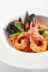 Delicious spaghetti with seafood and tomatoes