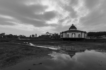 beautiful sunrise and reflection over unique architecture mosque in malacca