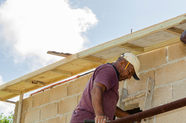Tradesman Climbing Down Ladder