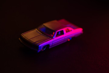 Obraz na płótnie Canvas Toy car under red and blue lights