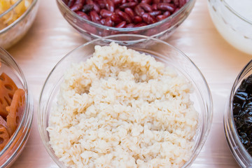 White millet, ingredient of thai dessert in glass bowl, top view, Tub Tim Grob