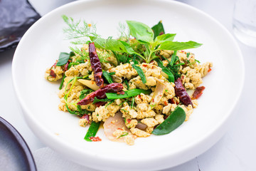 Tradition northeast food Isaan delicious on white bowl. Eggs dry soup herbs and spices ingredients Thai food served on bowl.