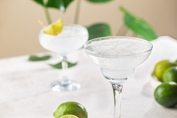 Refreshing Homemade Classic Alcoholic Margarita Cocktail with Lime and Salt on light background