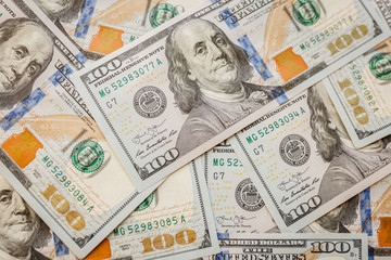 One hundred dollars pile as background