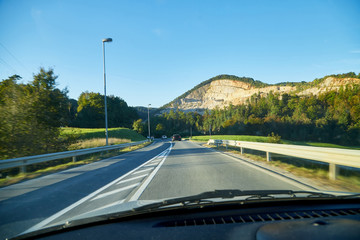 View of the road with a beautiful mountain landscape from the car window