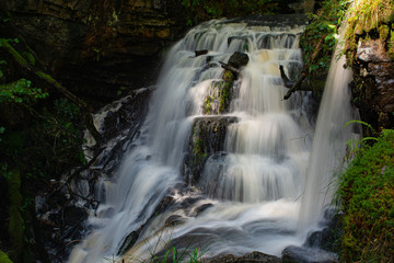 Fototapeta premium A small tiered tributary stream.