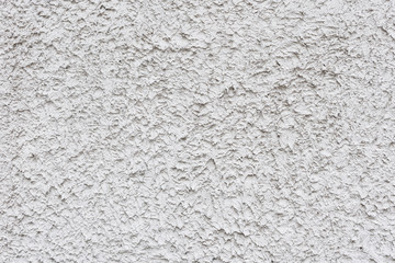 Rough white relief stucco wall texture background. blank for designers