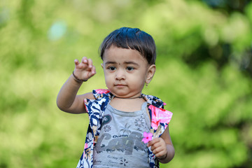 cute indian baby girl  playing in the park