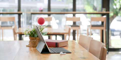 Comfortable co-working space with tablet with keyboard and decorations