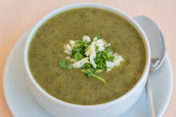 Green cream soup from spinach, close up