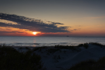 Sunset on coastline of Baltic sea.