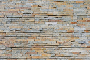 Natural facade stone decoration quartzite background texture. modern granite stone wall