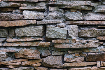 Natural facade stone decoration quartzite background texture. modern granite stone wall