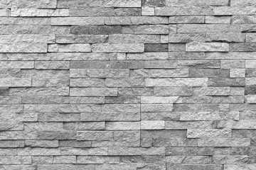 Gordijnen Witte natuurlijke gevelsteen decoratie kwartsiet achtergrondstructuur. moderne granieten stenen muur. © Илья Подопригоров