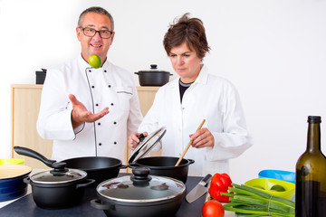 Woman with Chef Cook in the kitchen