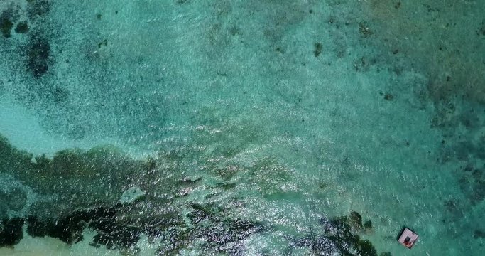 top view of sea waves in indonesia, looking down forward drone shot
