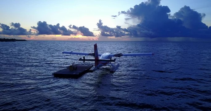 float plane in maldives, forward low altitude drone shot