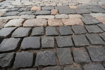 Texture of square paving stones in perspective is close