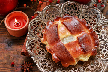 Traditional apple pie and autumn decorations around it.
