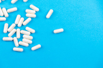 Obraz na płótnie Canvas Tablets medicaments on a blue background