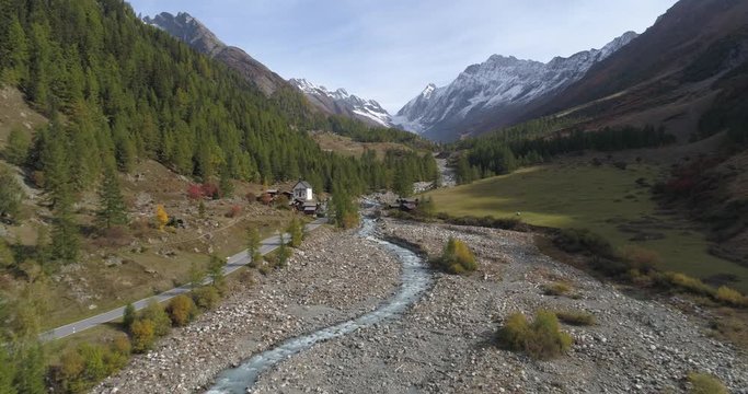 K&uuml;hmad small village approach in L&ouml;tschental - Aerial 4K
