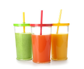 Glasses of fresh juice isolated on white