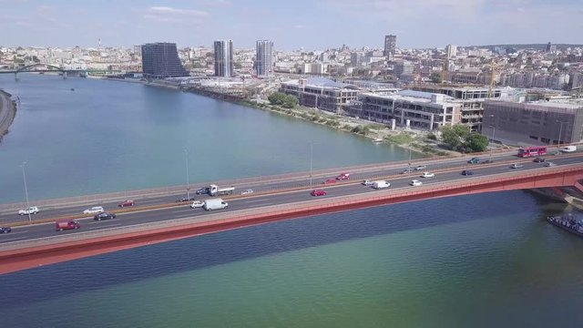 Beautiful ascending opening shot of Gazela bridge and Belgrade city center in Serbia, summer day aerial