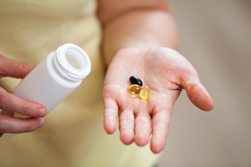 Fototapeta premium Nutritional supplements in the palm of your hand