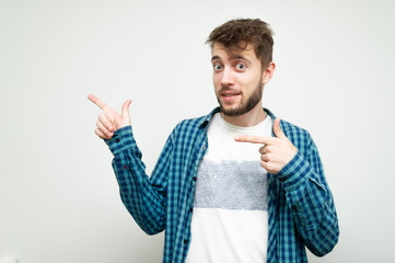 young man pointing at something interesting