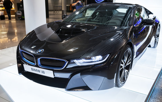 FRANKFURT, GERMANY - AUGUST 28, 2014: Photo of black BMW series i8 innovation car  Advertising stand in the passenger terminal, airport of Frankfurt