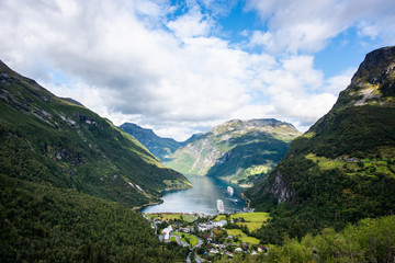 Fototapeta na wymiar Beautiful aerial landscape view Geiranger village, harbor and fjord in More og Romsdal county in Norway.