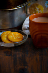 Cup of chai with biscuit