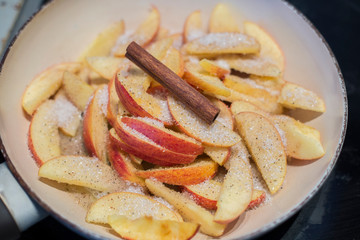 Caramelized apples close up in pan top view