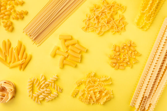 Italian pasta variety, shot from above on a yellow background, a flat lay banner