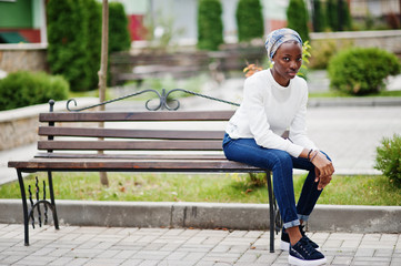 Obraz premium Young modern fashionable, attractive, tall and slim african muslim woman in hijab or turban head scarf posed.