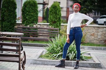 Young modern fashionable, attractive, tall and slim african muslim woman in hijab or turban head...