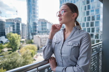 Beautiful business woman on the background of the modern office