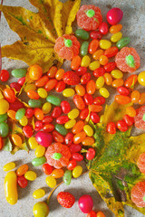 Fototapeta na wymiar autumn color candies on granite surface