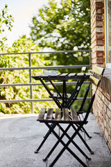 A place to relax. Terrace of a country house. Table with chairs