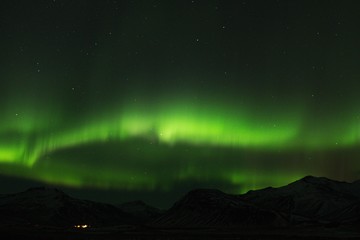 Naklejka na ściany i meble Aurora Borealis on Iceland night sky