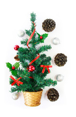 green christmas tree with multi-colored shiny toys balls for the holiday new year