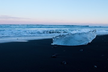 Small iceberg on black diamond beach
