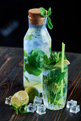 Mixology of ingredients. Cocktails is ready. On the wooden table in the night club. Nice lighting
