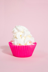 simple pink silicone cupcake mold and whipped cream